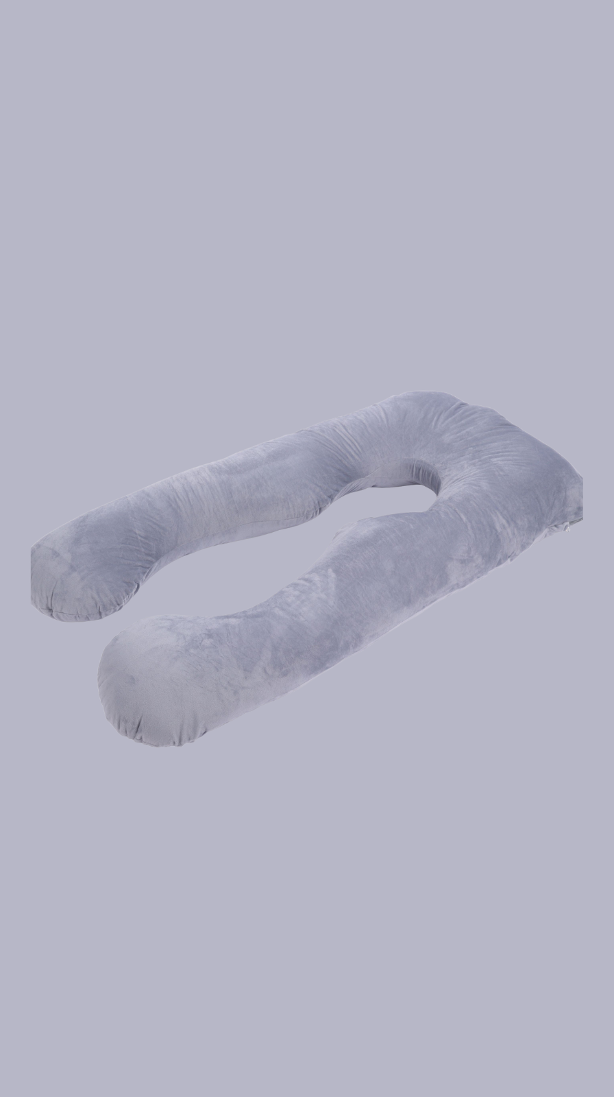 U-shaped pregnacy pillow against a gray sky