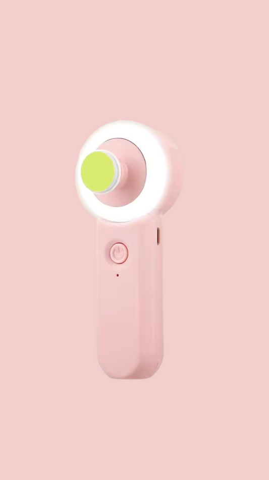Pink Baby nail trimmer light with a green button on a pink background