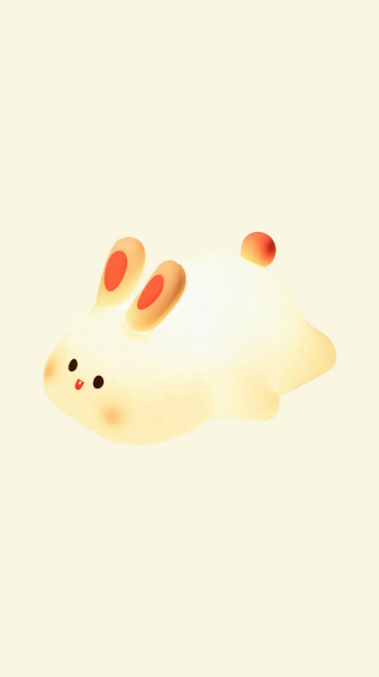 Cartoon bunny nightlight with red cheeks on a light yellow background