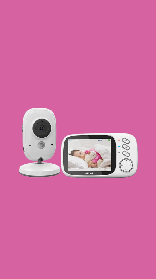 Baby monitor with screen displaying a baby on a pink background