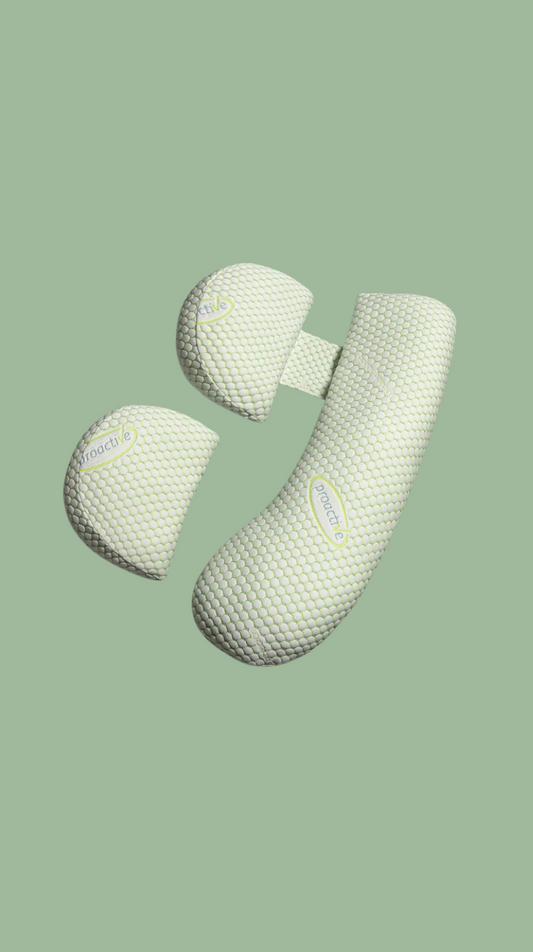 Pair of green textured knee pads on a light green background